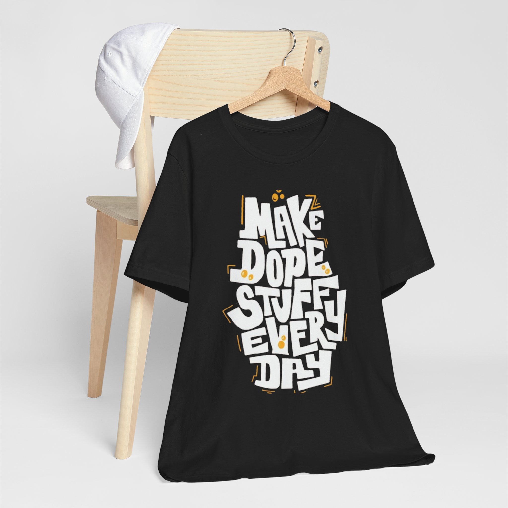 Black t-shirt with 'Make Dope Stuff Everyday' text on a white background