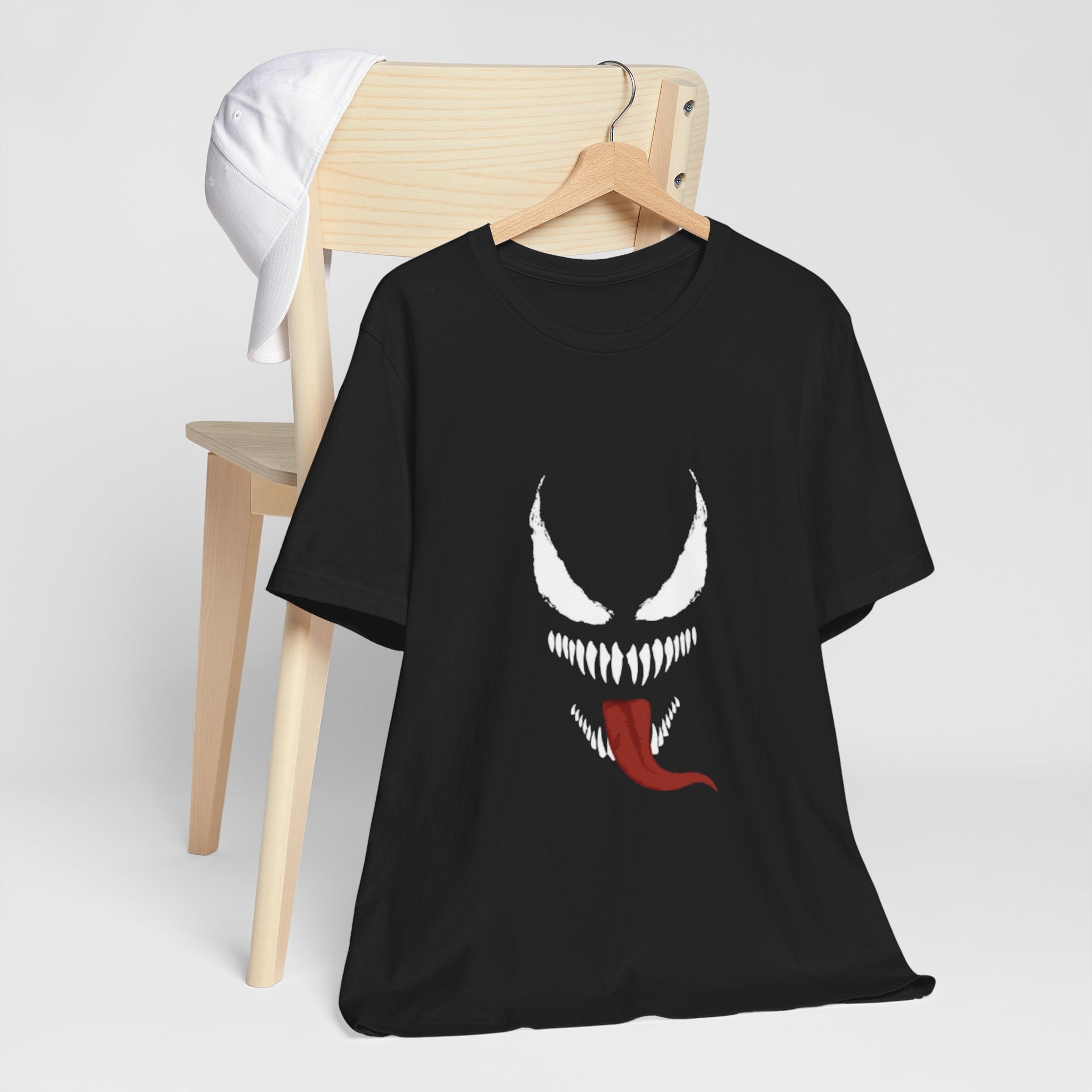 Black t-shirt with a Venom graphic design on a white background