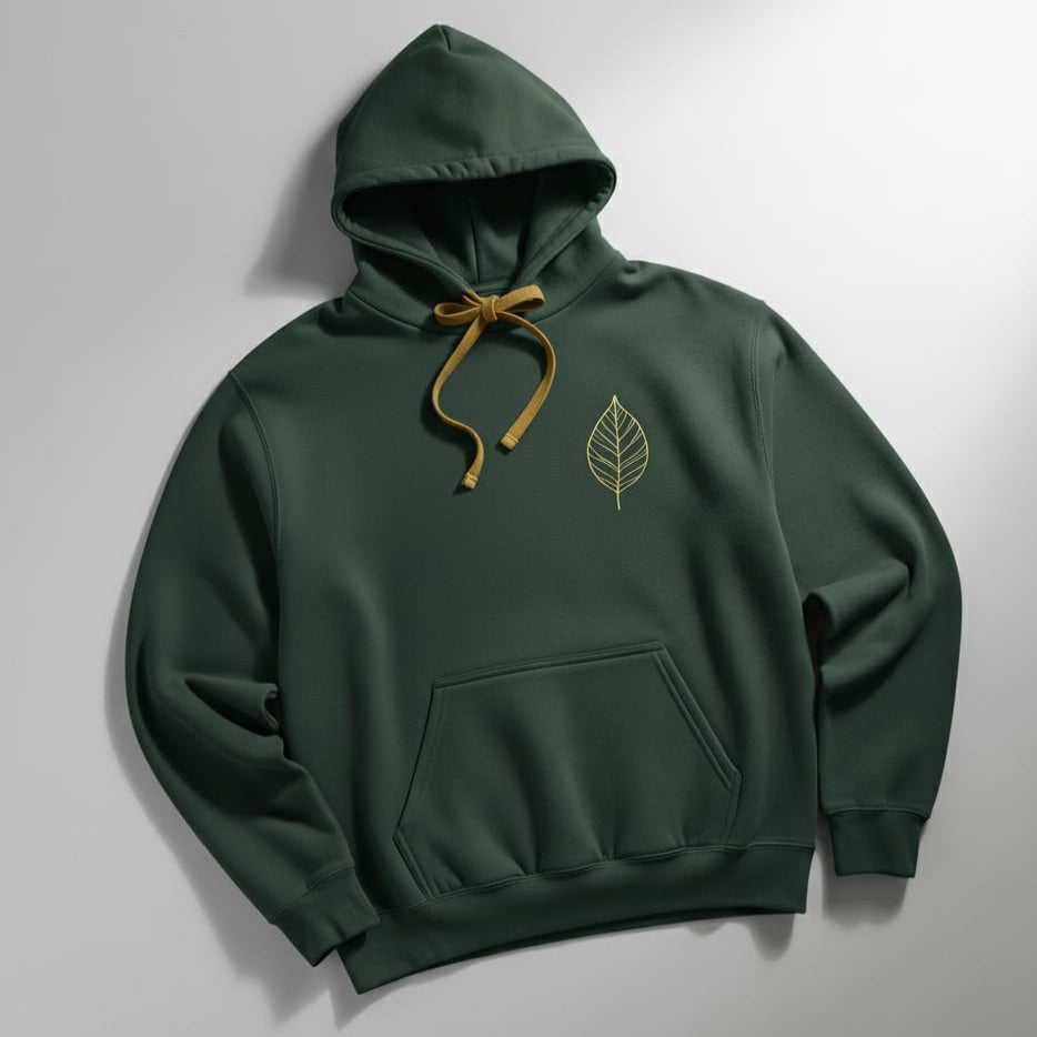 Green hoodie with a leaf emblem on a gray background